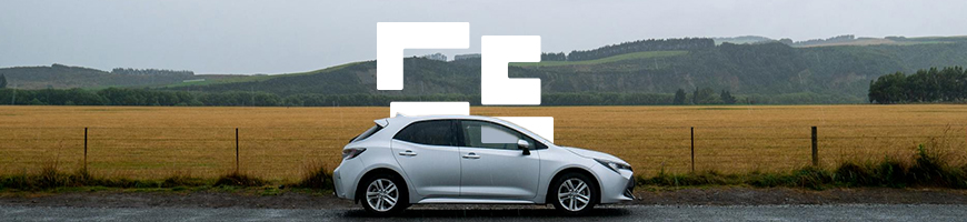 Car in front of field