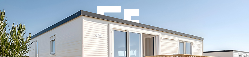 Static caravan under a blue sky on a sunny day