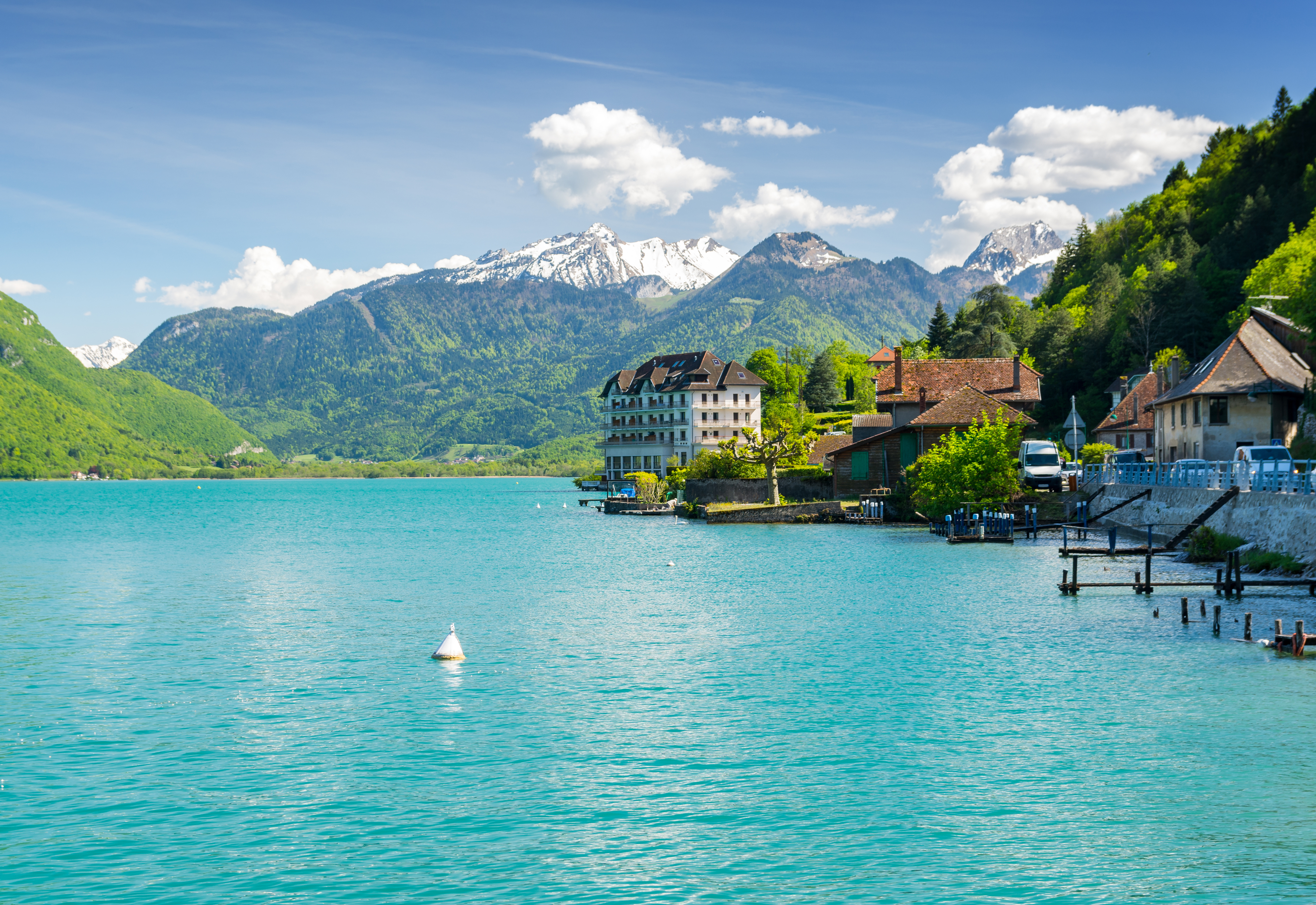 View of the snow-capped French Alps from Lake Annecy