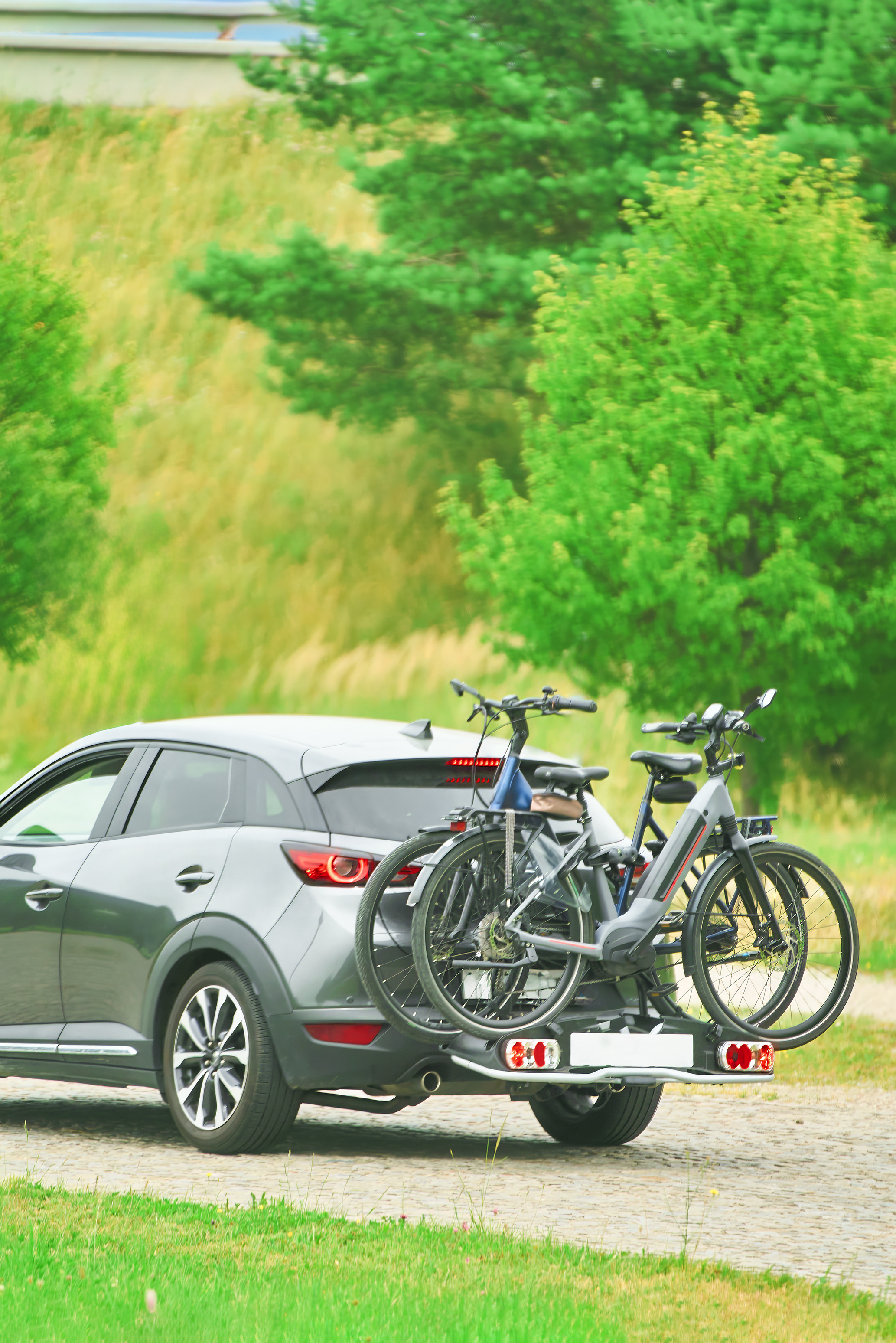 Bicycles attached to bike rack on the back of a car
