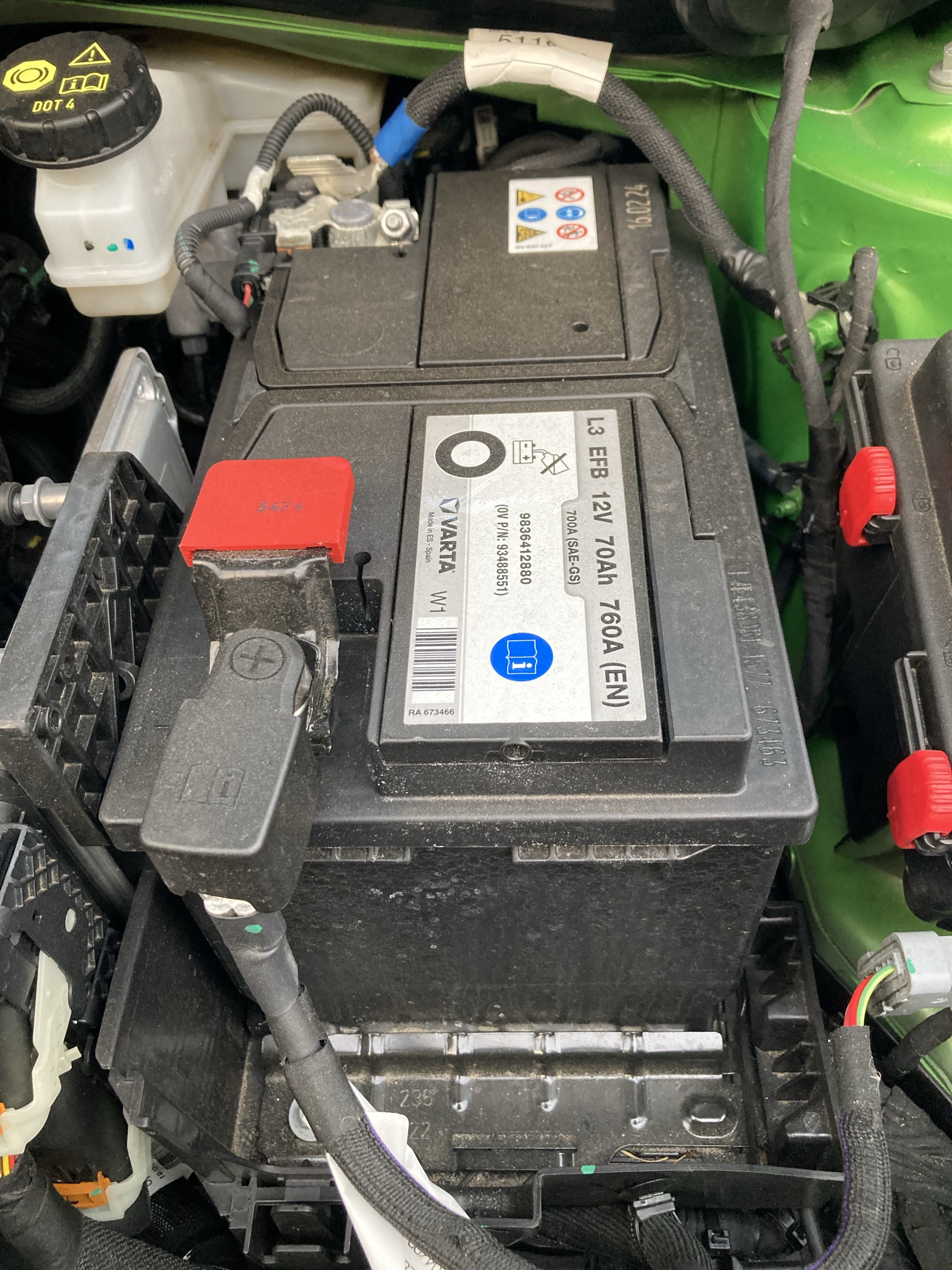 Car battery located underneath car bonnet