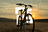 Free standing pedal bicycle with golden sunset behind
