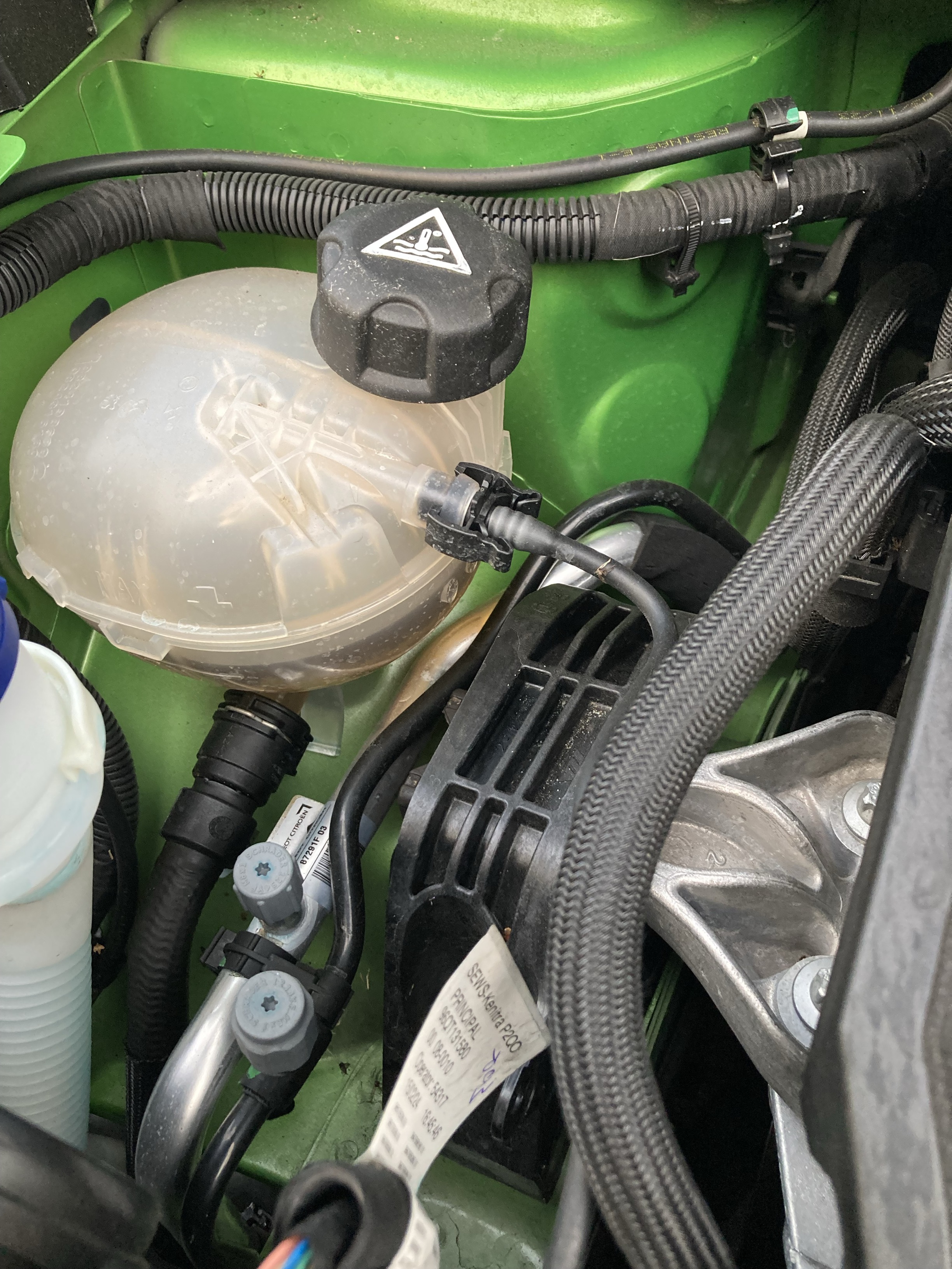 Engine coolant located underneath car bonnet