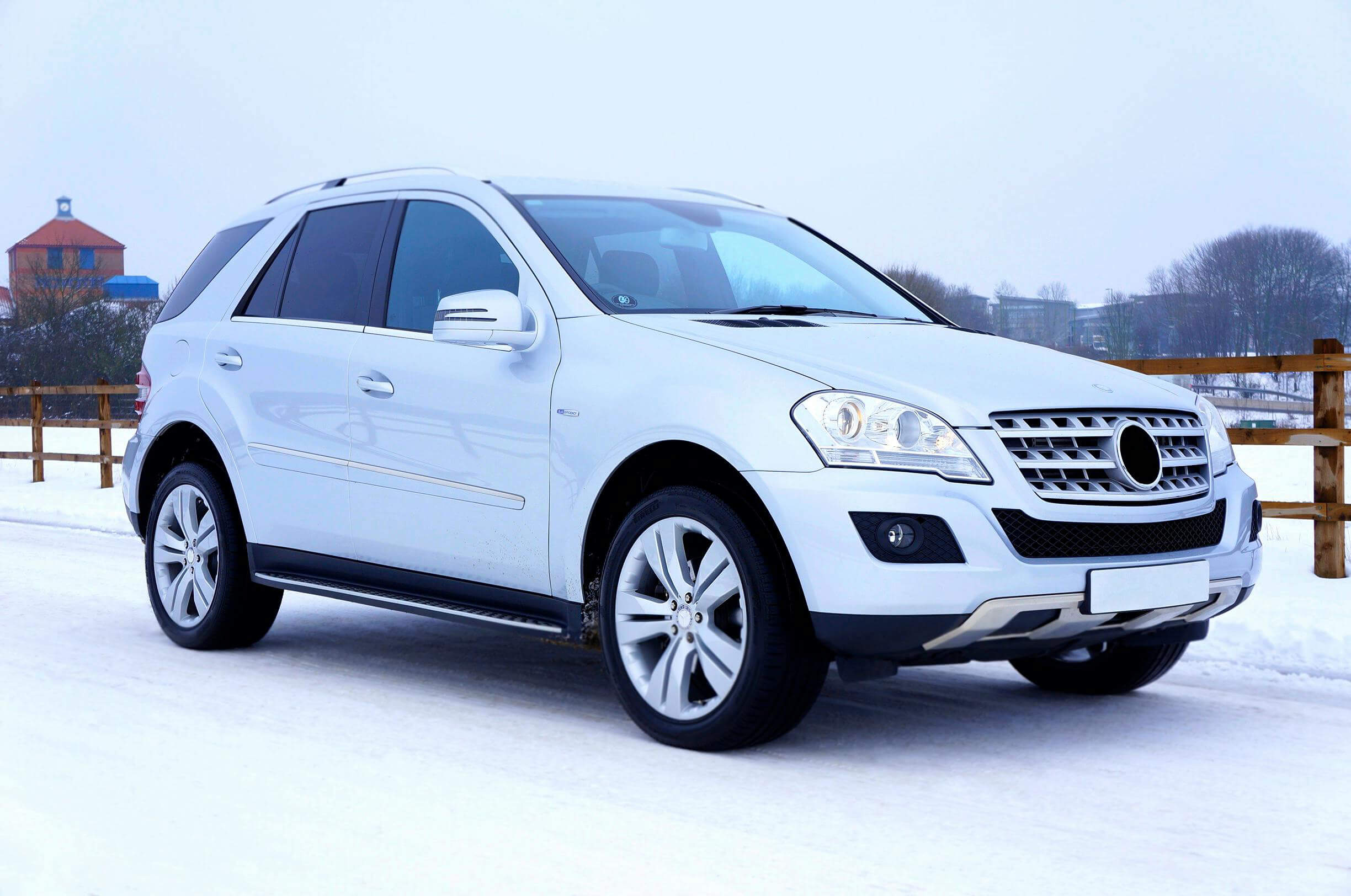 white car on snowy ground