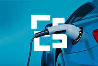 An electric car connected to a charging station