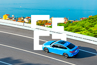A blue car drives on a curved coastal road with lush green hills to the right and a serene blue sea in the background