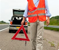 Setting out warning triangle behind a car